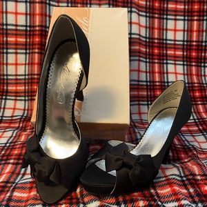 Size 9 black dress shoes only worn once. Stored in original bags and box